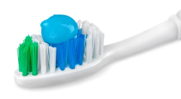 Toothbrush with toothpaste isolated on white background