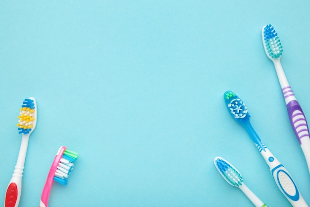 Toothbrushes on blue background isolated