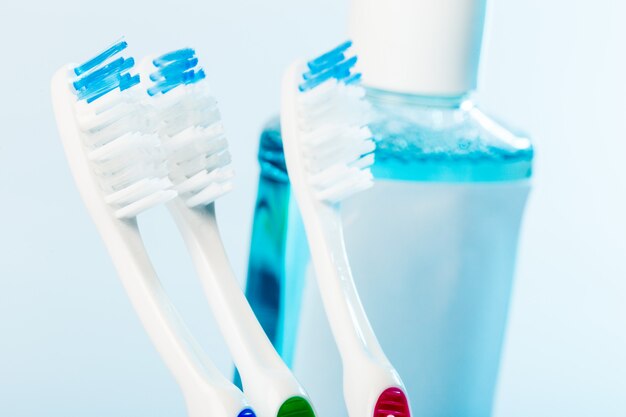 Toothbrushes in glass on table