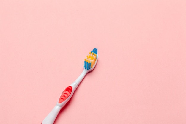 Toothbrushes on pink background