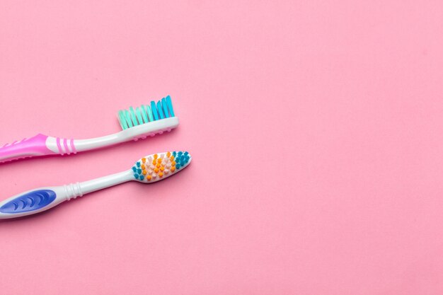 Toothbrushes on pink background