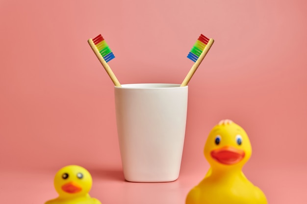 Toothbrushes in plastic cup and duck toy