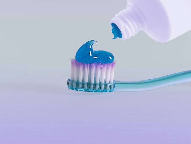 Зубная паста выдавливается на зубную щетку.