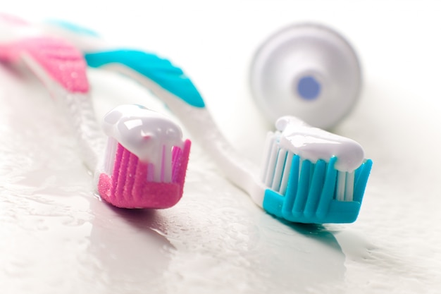 Toothpaste and toothbrushes closeup. dental care