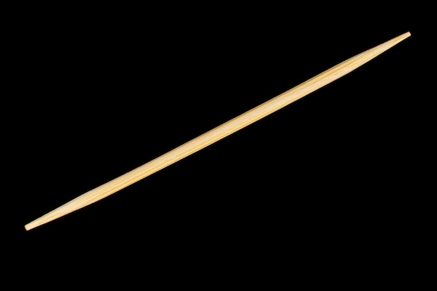 Toothpick one black background closeup