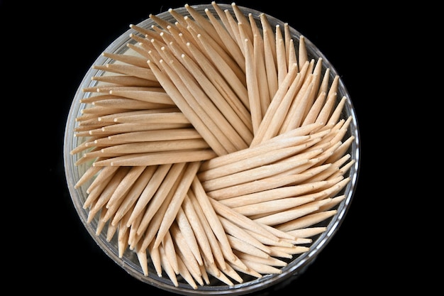 Toothpicks in a box on a dark background