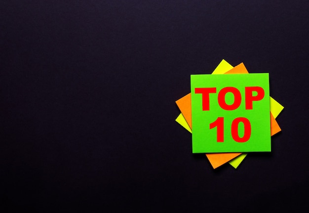 TOP 10 on a bright sticker on a dark background.