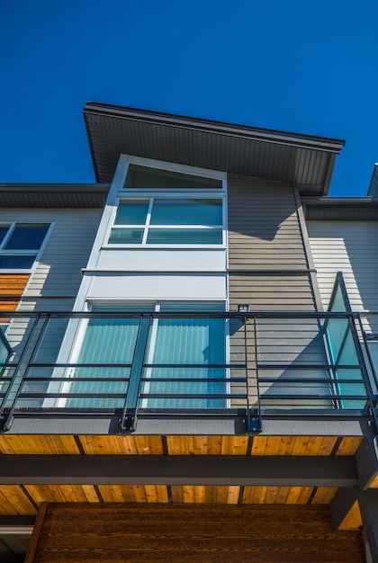 Top of brand new townhouse building on blue sky background