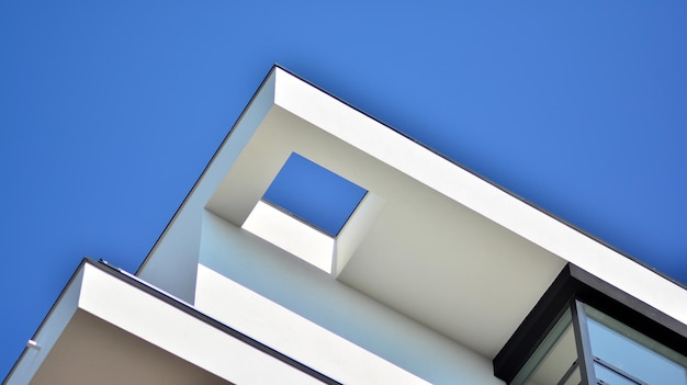 the top of a building with a blue sky background