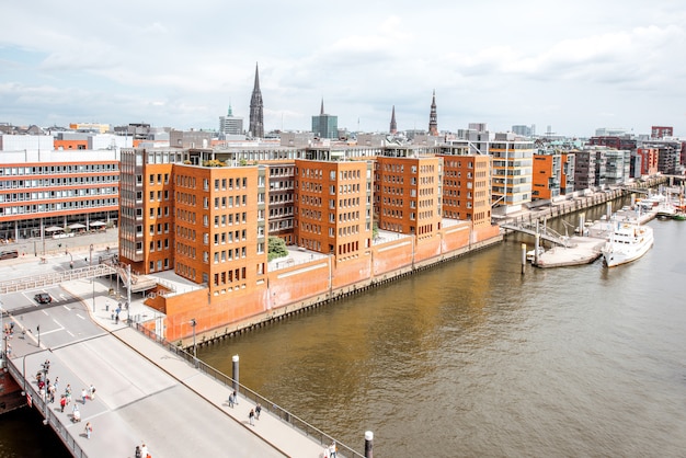 Top cityscape view on the Hafencity with old red brick warehouses in Hamburg city, Germany