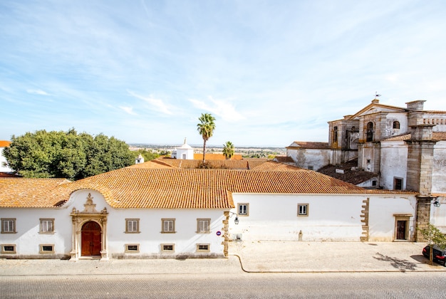 Top cityscape view with monastery building in Evora city in Portugal