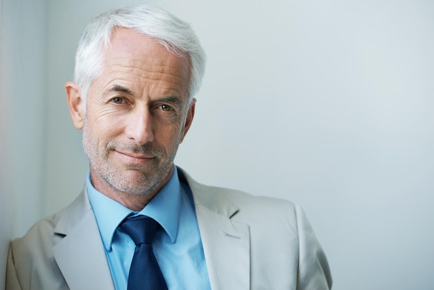 Photo top of the corporate ladder portrait of a confidentlooking mature businessman