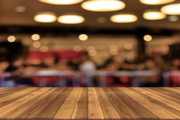 Top desk with blur restaurant backgroundwooden table