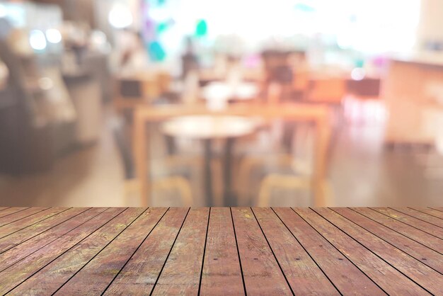 Top desk with blur restaurant backgroundwooden table