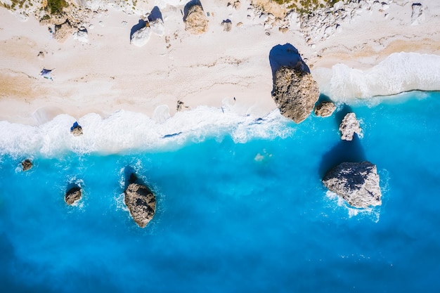 Top down aerial view of Kalamitsi rocky beach Ionian Sea Lefkada island Greece