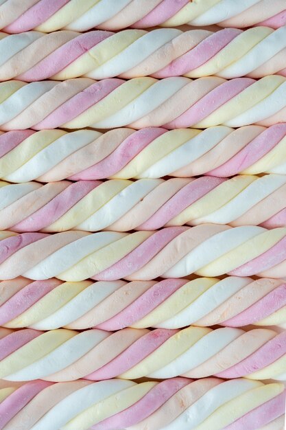 Top down view of colorful marshmallow sweets in Dutch kabelspekjes in pink yellow white orange