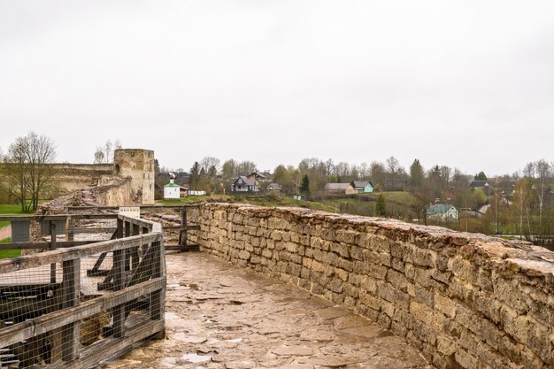 At the top of the fortress wall. touching history. Izborsk Fortress. Izborsk Pskov Oblast. Historical places of Russia.