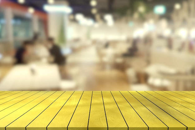 top golden metal desk with blur restaurant background