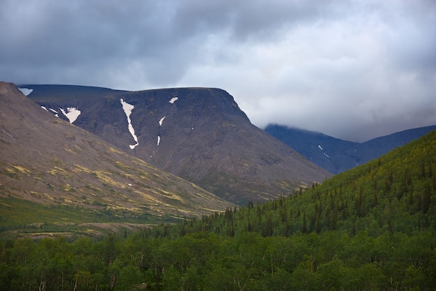 Top mountain Khibiny in the form of a surface of the cloudy sky.