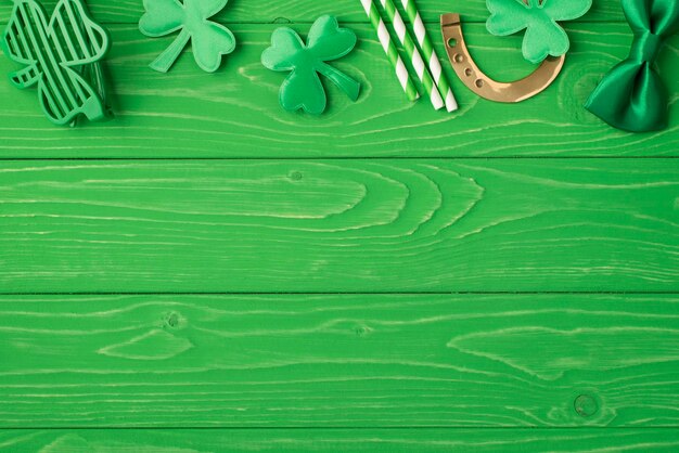 Top above overhead close up view photo image of st patrick's day party accessories isolated over bright color green table desk with place for copy space