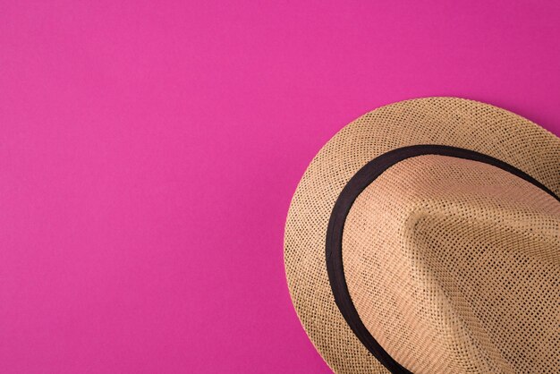 Top above overhead view photo of a hat isolated on pink background