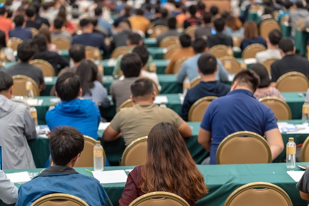 Top Rear view of Audience in the conference hall or seminar meeting