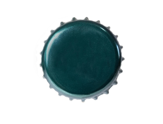 Photo the top side of a green metal bottle cap isolated on white background