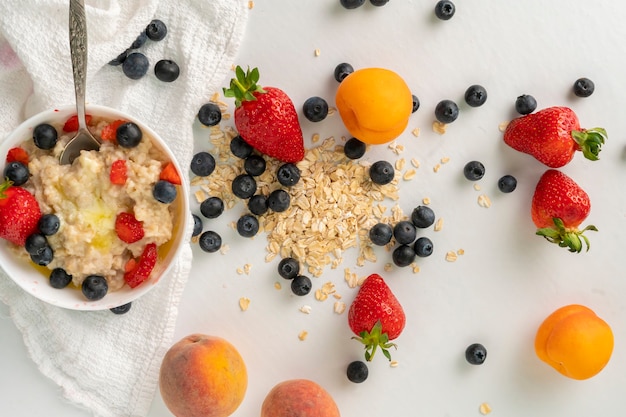 Top vief of different cereal and berries flat lay on the table, healthy vegan food