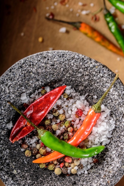 Top View 4K Image of Red Chilli Red Pepper Flakes and Sea Salt and pepper in Mortar and Pestle