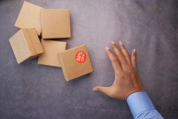 Top view of 50 percent discount sign on a box on table