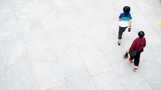 top view aerial of people walk in pedestrian street