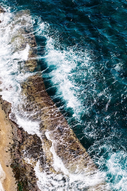 Top view aerial photo from flying drone of an amazingly beautiful sea landscape with turquoise water. Perfect website background