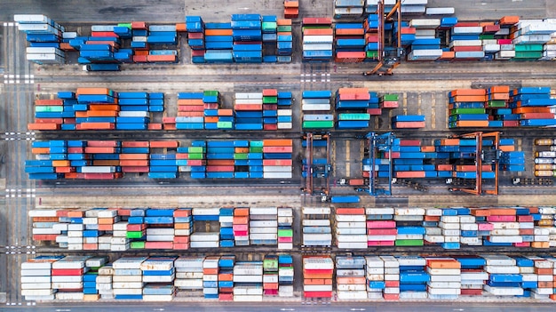 Top view aerial photo of stack of freight containers in rows