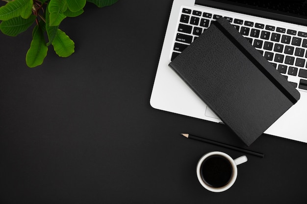 Top view of agenda laptop and coffee