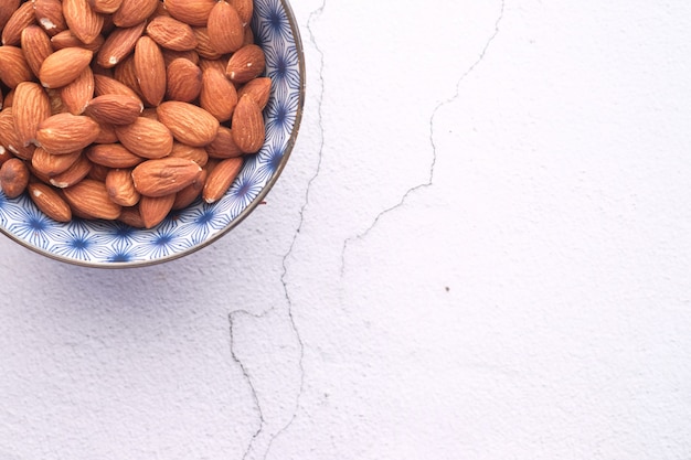 Top view of almond in a bowl on table