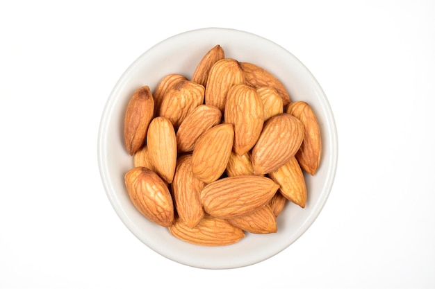 top view of almond in white bowl isolated on white background