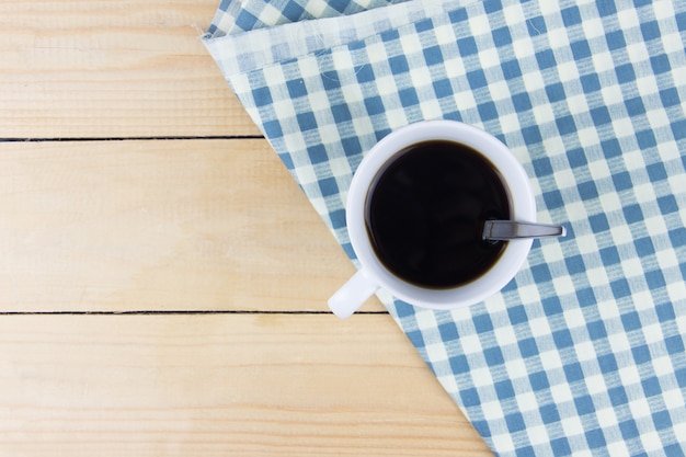 Top view angle of hot coffee on napkin white and blue