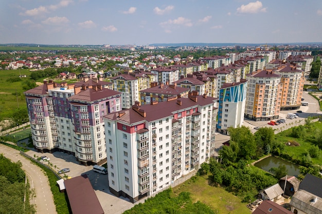 Top view of apartment or office tall buildings, parked cars, urban city landscape.