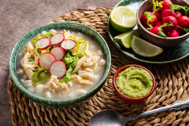 Photo top view on appetizing pozole bowl