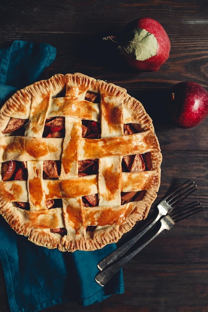 Top view on an apple pie on a wooden table Rustic moody food photography