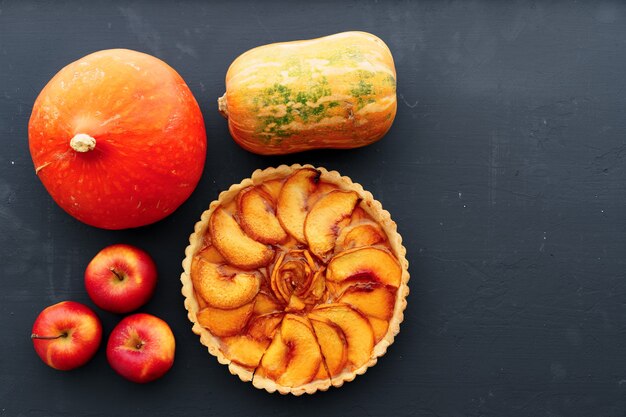 Top view of apple tart pie on wooden board