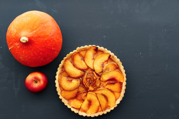 Top view of apple tart pie on wooden board