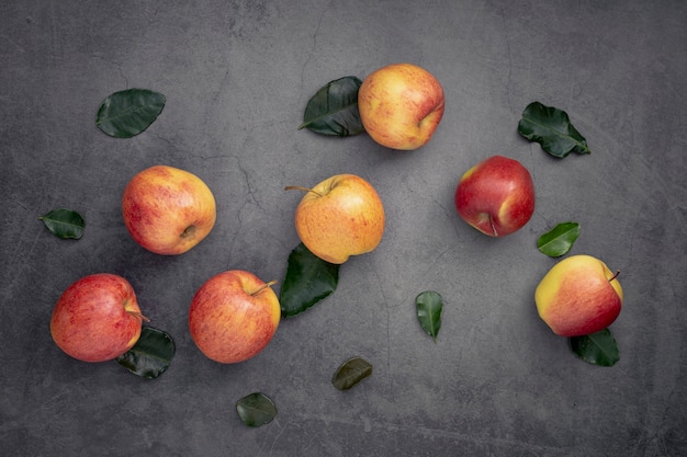 Top view of apples with leaves