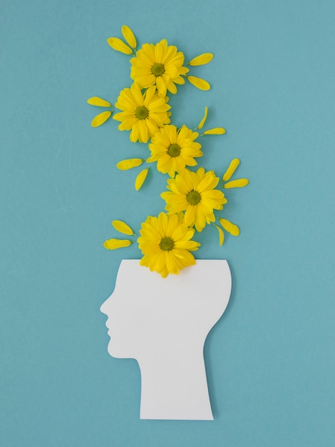 Top view arrangement of optimism concept with flowers