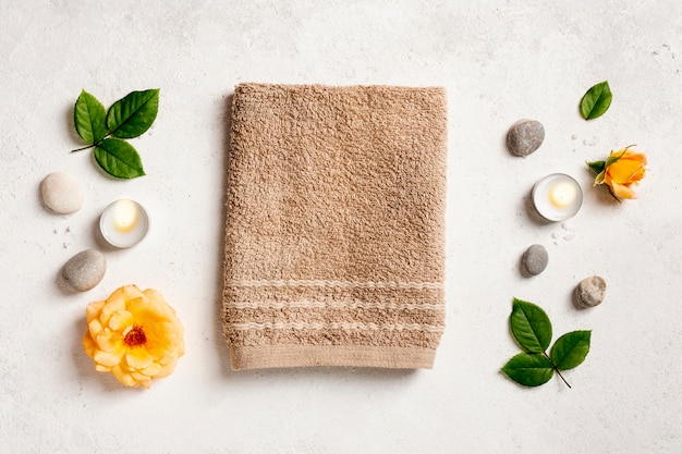 Top view arrangement with towel and candles