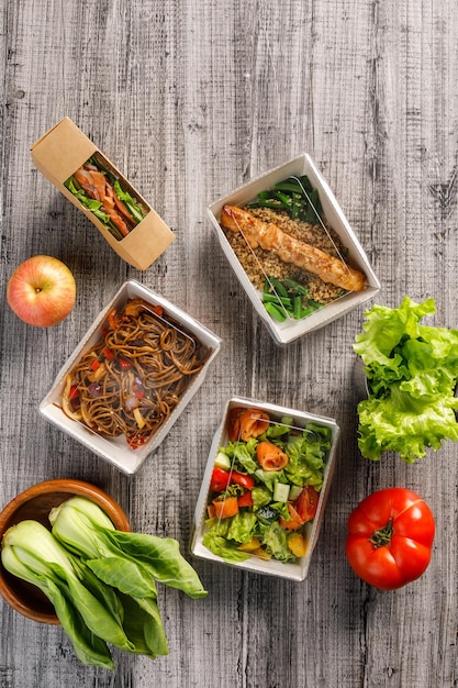 Top view of assortment of healthy food to go healthy food in\
takeaway containers