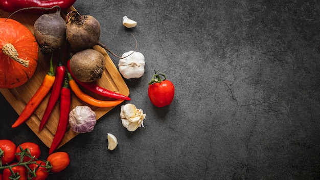 Photo top view assortment of veggies dark copy space background