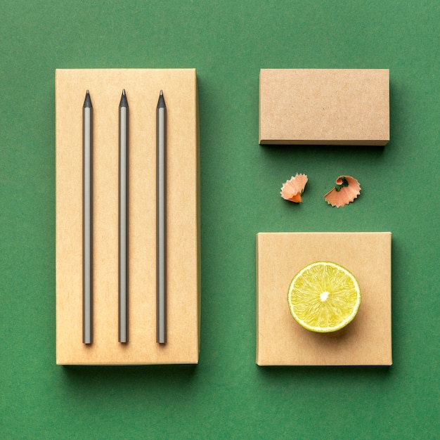 Top view assortment with stationery elements and fruit