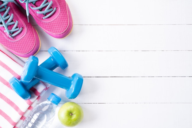 Top view of athlete's equipment on wooden table