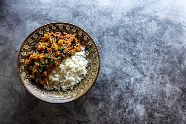 Photo top view of basil rice with pork or beef, thai food